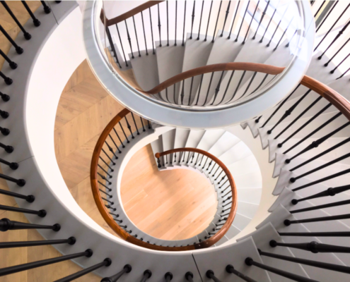 North West England Factory Supply Install Bespoke walnut handrails Helical staircase Private client Precise surveying methods Custom rails French polishing Three floors Steel core rail Fastest handrail company Project completion in weeks