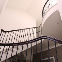 Dark coloured timber handrail with Black steel spindles