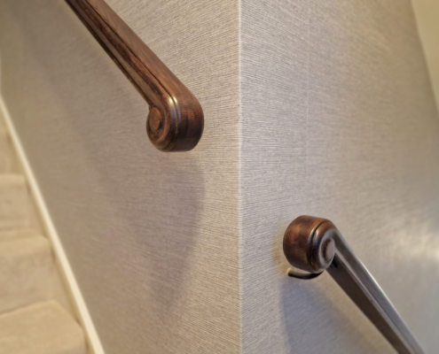European Oak handrails Luxury home design Handrail Creations Traditional shape and groove Metal core rail French polished Rams horns Wall-mounted handrails Bespoke handrails Fine materials Craftsmanship Safety feature Timeless elegance London design and build company Continuous handrail