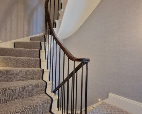 European Oak handrails Luxury home design Handrail Creations Traditional shape and groove Metal core rail French polished Rams horns Wall-mounted handrails Bespoke handrails Fine materials Craftsmanship Safety feature Timeless elegance London design and build company Continuous handrail