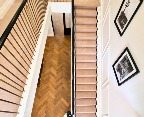 Sapele timber handrails with a rich, dark brown finish at 'Fairfields.'