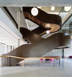 Stunning cantilever staircase with Bespoke hardwood handrails at university of Essex. Hand finished and oiled.