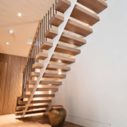 Handrail Creations residential project Chelsea, London European Oak handrail staircase craftsmanship elegance sophistication hardwood traditional methods seamless integration curved staircase engineering design grandeur continuous handrails balustrade bespoke spindles charm durability natural beauty