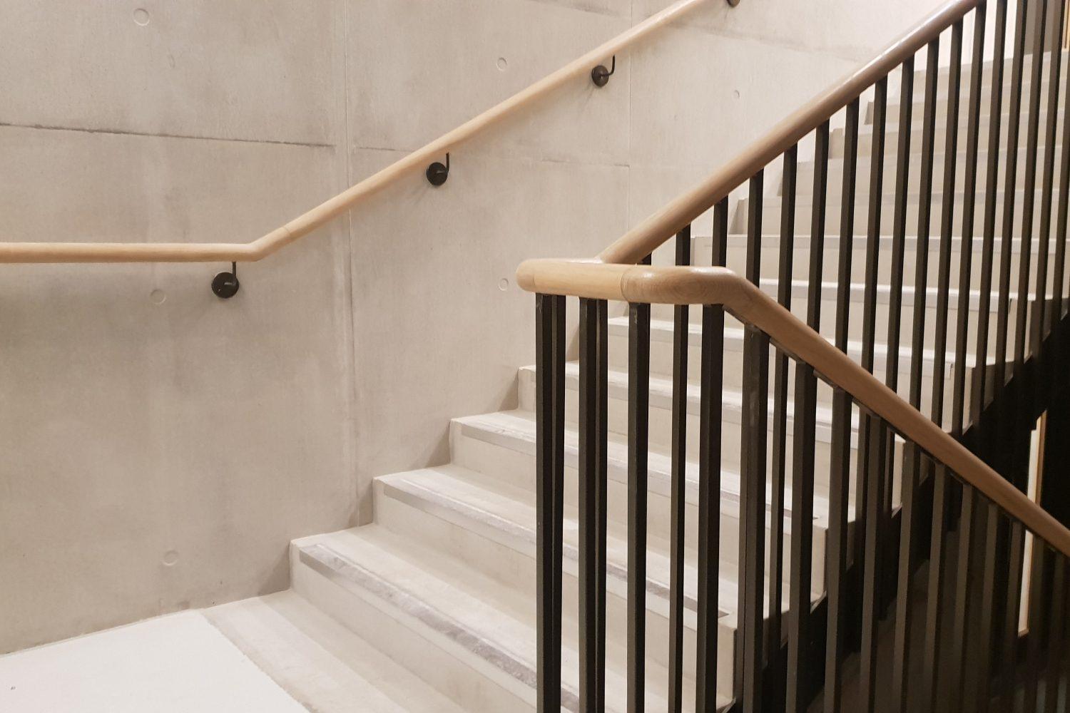 University College London handrail installation FSC oak black walnut bespoke tooling digital surveys 5-axis capacity project management installation capabilities building regulations educational environment