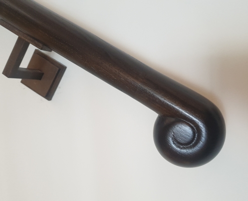 Handrail scroll and wall bracket
