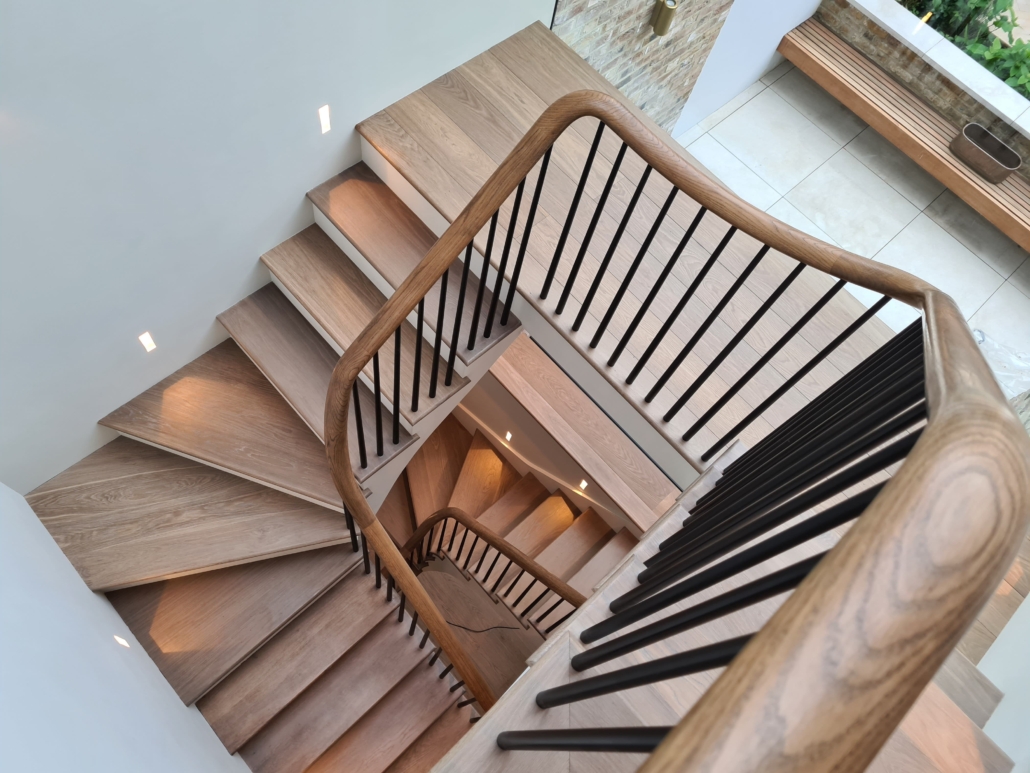 Handrail Creations, bespoke oak handrails, curved handrails, Kensington, contemporary balustrade, London based team, stained, French polished, stunning finish, residential projects, gallery page.