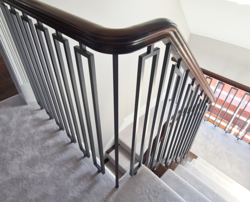 Previous project Private client Design team Home in Manchester Fabrication company Uninspiring Unsafe balustrade Curved continuous handrails FSC certified sapele Bespoke metal balusters Powder-coated grey Compliment the decor Square balusters No core rail CNC machine pockets French polishers Stained and polished Bring to life