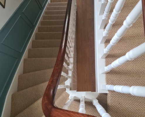 Traditional and beautiful Client's brief Continuous Sapele handrails Spindles Custom-made bun shape 5 axis CNC machines French polished Bespoke newel cap Turned spindles Prime coated Tenoned New cut string staircase Craftsman On-site installation Balustrade Ground to second floor No newel posts No steel reinforcement Delighted client Expert chippie Impressed