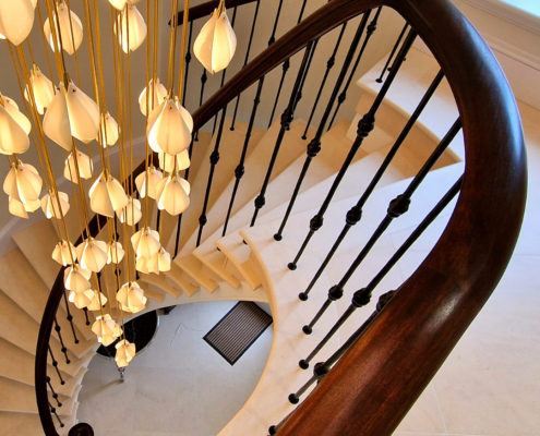 circular staircase, curved stone staircase, continuous handrail, sapele wood, core rail, CNC machine, bespoke scrolls, French polished