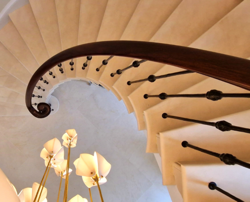 circular staircase, curved stone staircase, continuous handrail, sapele wood, core rail, CNC machine, bespoke scrolls, French polished