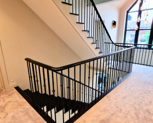 American Ash handrails in modern staircase design.