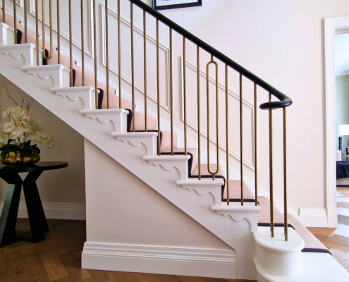 Custom CNC-manufactured wooden handrails for feature staircases in Surrey.