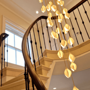circular staircase, curved stone staircase, continuous handrail, sapele wood, core rail, CNC machine, bespoke scrolls, French polished