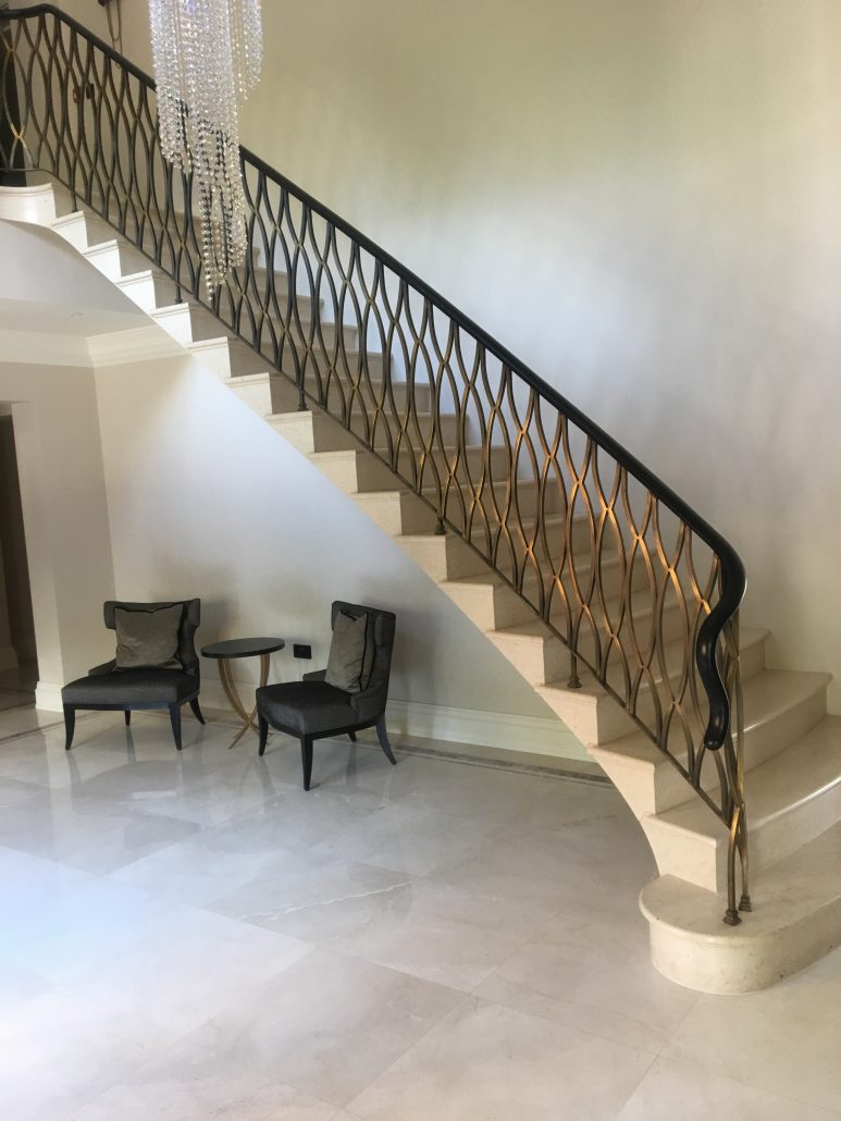 Handrail Creations black handrail balustrade antique brass finish Midlands brass and bronze metal finishes wooden handrails specialist polishing teams entrance hall curved landing stunning design