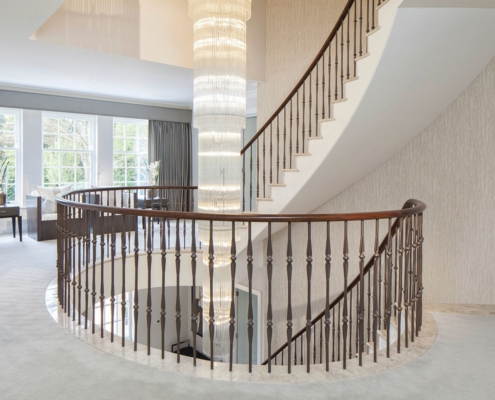 Walnut handrail Supply-only Ascot Absolute precision Fast installation Efficient installation Surveyed Loose steel spindles Traditional core rail No margin for error Cutting Pre-assembling 6000 sq foot factory Site delivery Pre-drilling Cost-saving Time-saving Fabricating Contemporary look Client's desire