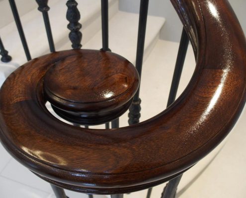 handmade stone staircase attention to detail steel spindles sapele handrail fully moulded profile shape of the steel core rail manufacturing hand finishing tolerance of less than 1mm volute small bun stained French-polished traditional shellac