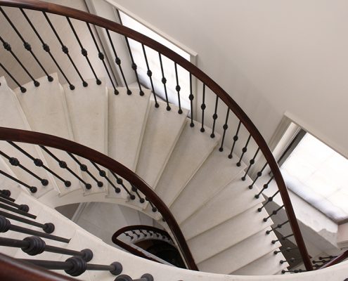 sapele handrails made to measure four sweeping flights Kensington home interior designers Albyns dark wood handrail feature staircase standard profile CNC manufacturing individual spindles steel core precision craftsman Manchester factory