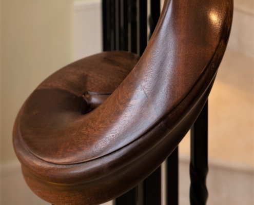 Continuous handrail Bespoke banister Residential project Notting Hill Sapele handrails Twisted square steel spindles No core rail Balustrade Three flights of timber stairs Stone cladding Rapid production time Accurate digital surveying Stained handrails Match internal doors French polished Satin sheen