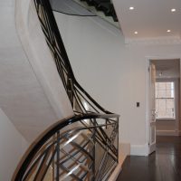 Black wooden handrail & steel balustrade