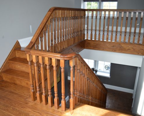 Ground floor to landing handrail and square spindles in Oak