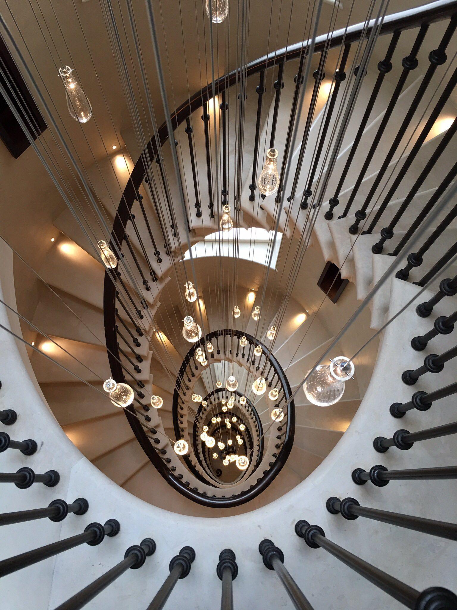 Spiral stone staircase continuous handrail and balustrade
