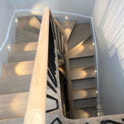 Handrail Creations, curved oak handrails, steel balustrade, Twickenham staircase, 3D scan, continuous handrails, millimetre, handrail and balustrade, Surrey, London, factory, Manchester, surveyors, handrail installers, oval section, steel spindles, polished, flooring.