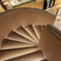 Curved staircase with Oak cladding & handrails