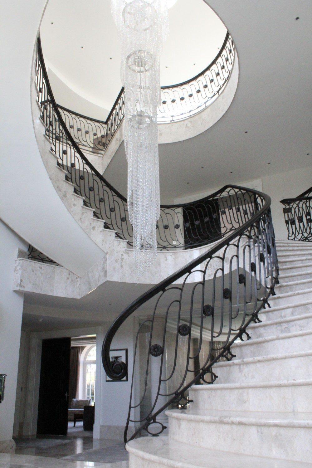 Kent: feature staircase with jet-black steel core rail and ash handrail stained and French polished