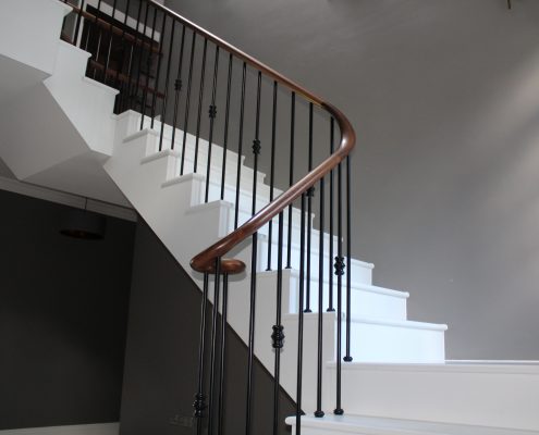 Luxury stone contemporary staircase with bespoke Walnut handrails & steel balustrade