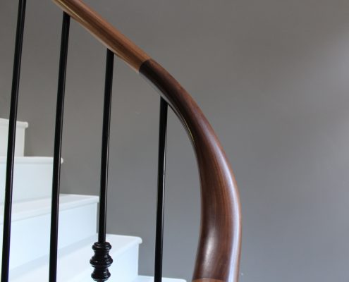 90 Degree wreathed Walnut handrail section on bespoke stone staircase