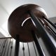 Walnut handrail volute with Black steel spindles