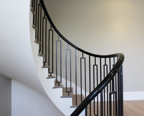 Little Boltons style steel balustrade with Sapele helical handrails both French polished Piano Black