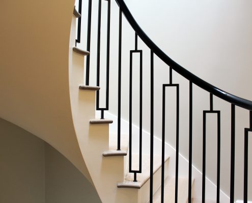 Little Boltons style steel balustrade with Sapele helical handrails both French polished Piano Black