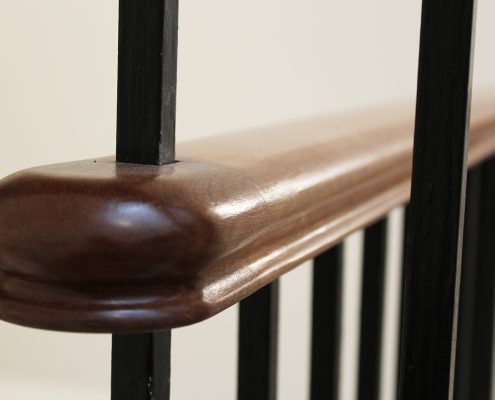 Square spindle fixed through Mahogany handrail