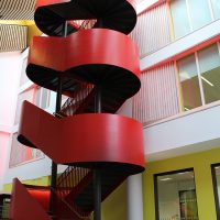Oak handrails in feature steel spiral staircase at Loseco College