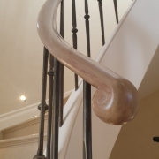 Handrail Creations, custom balustrade, curved handrail, helical steel staircase, sweeping handrail system, antique brass spindles, French polished, banister, steel core rail, strength, sapele handrail, drilled holes, London, bespoke handrails, curved balustrades.