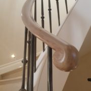 Handrail Creations, custom balustrade, curved handrail, helical steel staircase, sweeping handrail system, antique brass spindles, French polished, banister, steel core rail, strength, sapele handrail, drilled holes, London, bespoke handrails, curved balustrades.