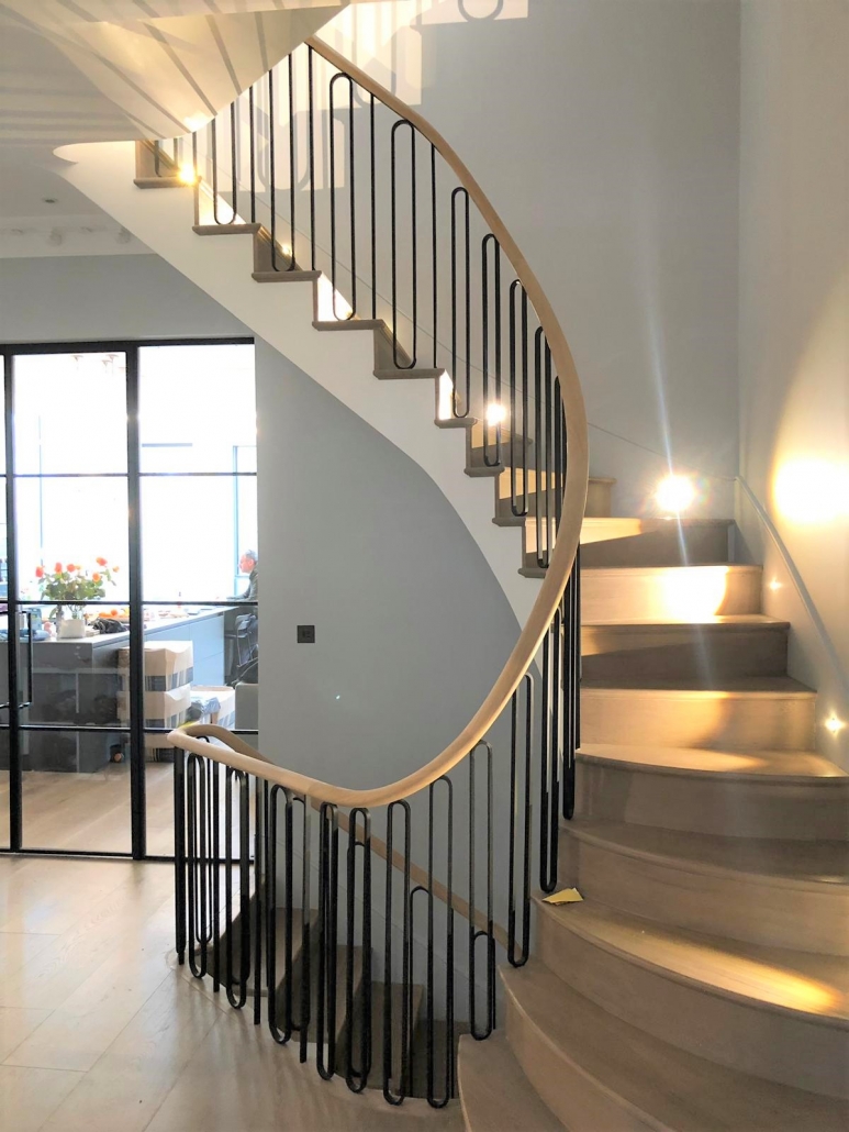 Handrail Creations, curved oak handrails, steel balustrade, Twickenham staircase, 3D scan, continuous handrails, millimetre, handrail and balustrade, Surrey, London, factory, Manchester, surveyors, handrail installers, oval section, steel spindles, polished, flooring.