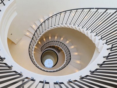 Spiral staircase with Black timber handrails & steel matching coloured balustrade