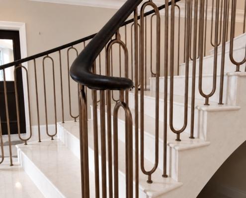 Oak handrail turn and bronze painted 16mm hoop spindles on stone treads