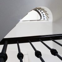 Black timber handrail and matching coloured steel spindles