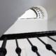 Black timber handrail and matching coloured steel spindles