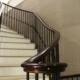 Walnut monkey tail with rising handrail and steel spindles