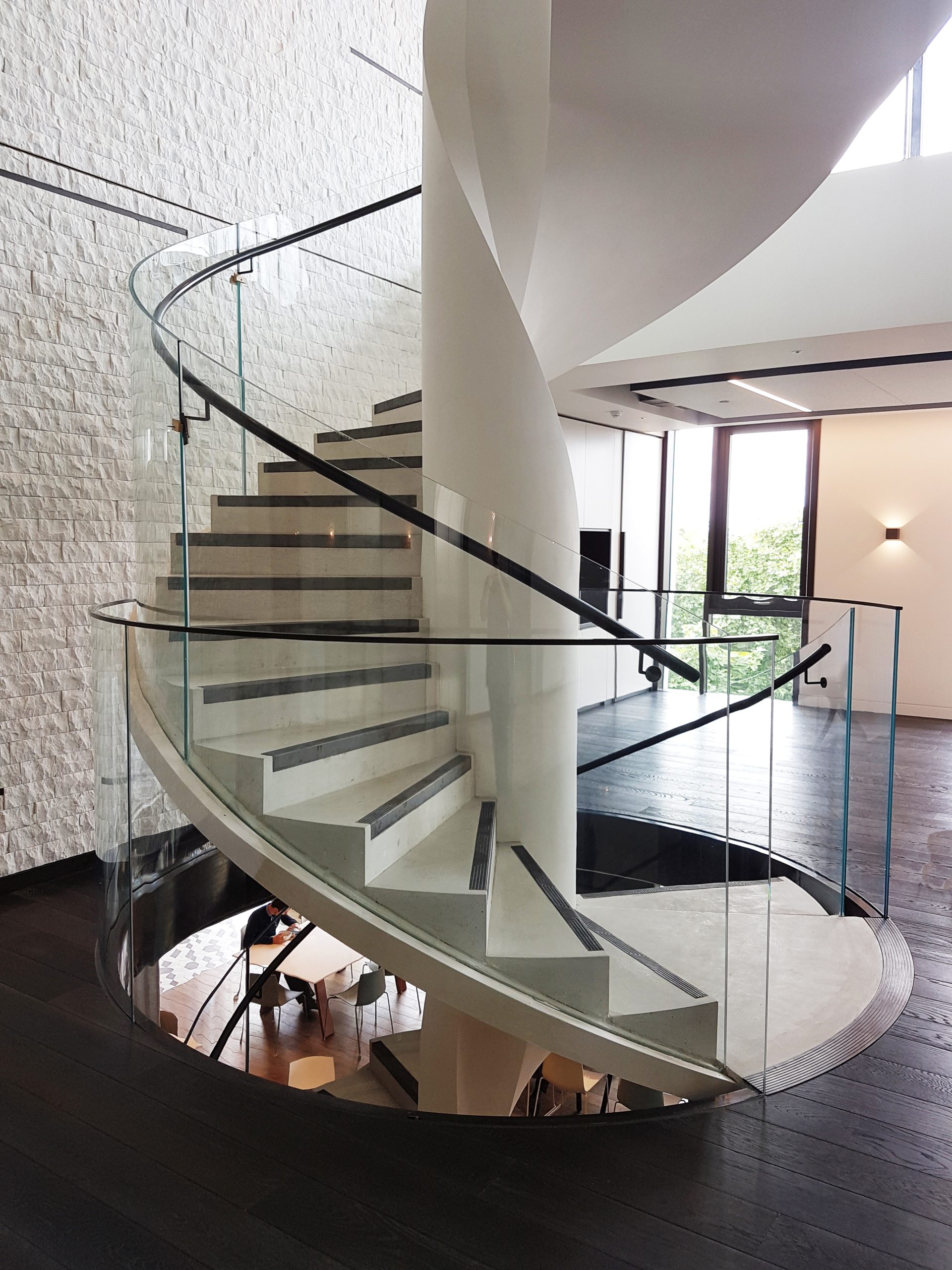 specialist steel fabricator black walnut handrail multi-million pound office fit out team worked through the night central London mopstick handrails building regulations master staircase glass, steel, and timber clean, contemporary style office fit out portfolio Google Apple BBC
