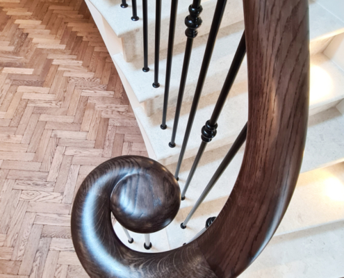 Dartnell curved wooden handrails wooden handrails spindles balustrade staircase Ash stained velvet black finish handrail Curved wooden handrails and spindles on stone-clad concrete staircase Custom made balustrade on curved concrete staircase Ash timber handrails and steel spindles with decorative collars Dark stained Ash handrails in contrast to painted joinery work Powder coated black balustrade pickets Chemically fixed spindles into handrail No core rail or welding required Installation of balustrade and handrail Self build project with remarkable results Testimonial from satisfied client