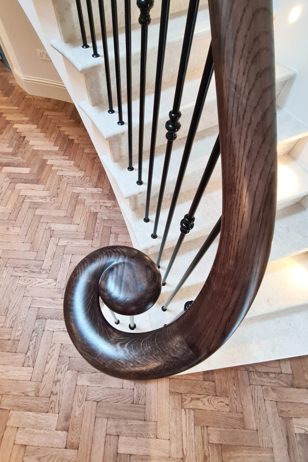 Dartnell curved wooden handrails wooden handrails spindles balustrade staircase Ash stained velvet black finish handrail Curved wooden handrails and spindles on stone-clad concrete staircase Custom made balustrade on curved concrete staircase Ash timber handrails and steel spindles with decorative collars Dark stained Ash handrails in contrast to painted joinery work Powder coated black balustrade pickets Chemically fixed spindles into handrail No core rail or welding required Installation of balustrade and handrail Self build project with remarkable results Testimonial from satisfied client